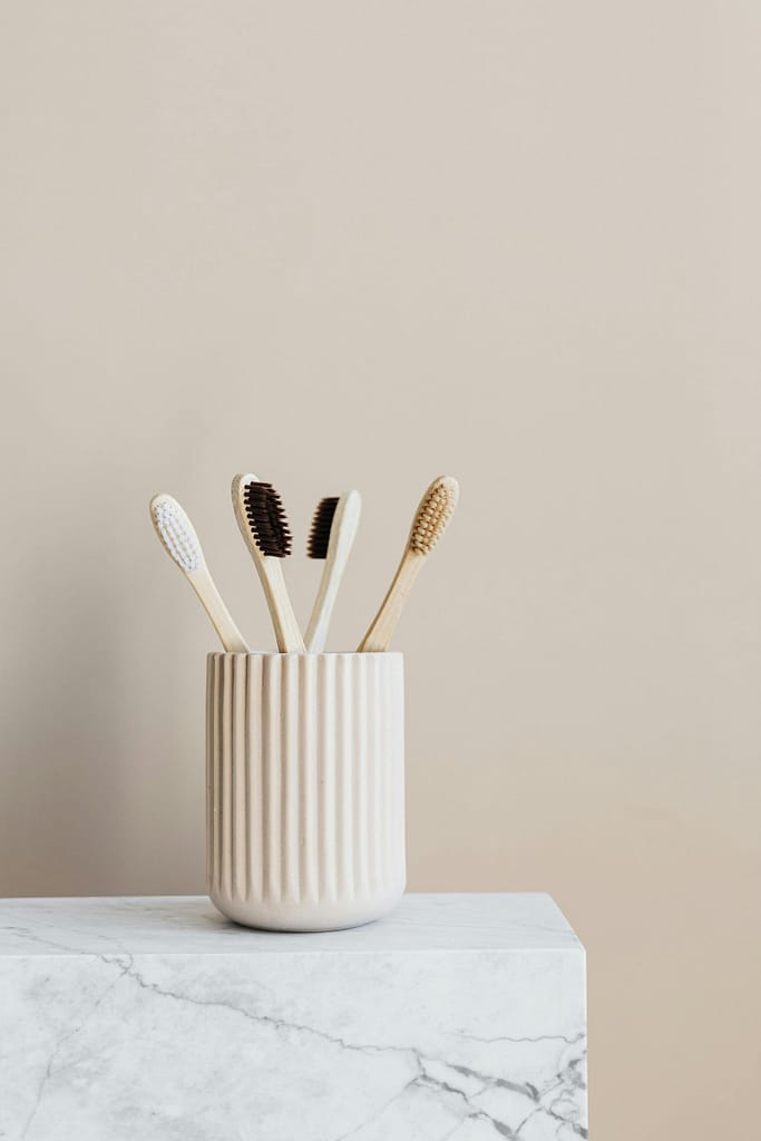 bamboo toothbrushes in ceramic container